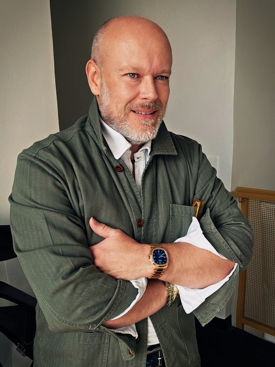 Petr Lukeš wearing an olive shirt