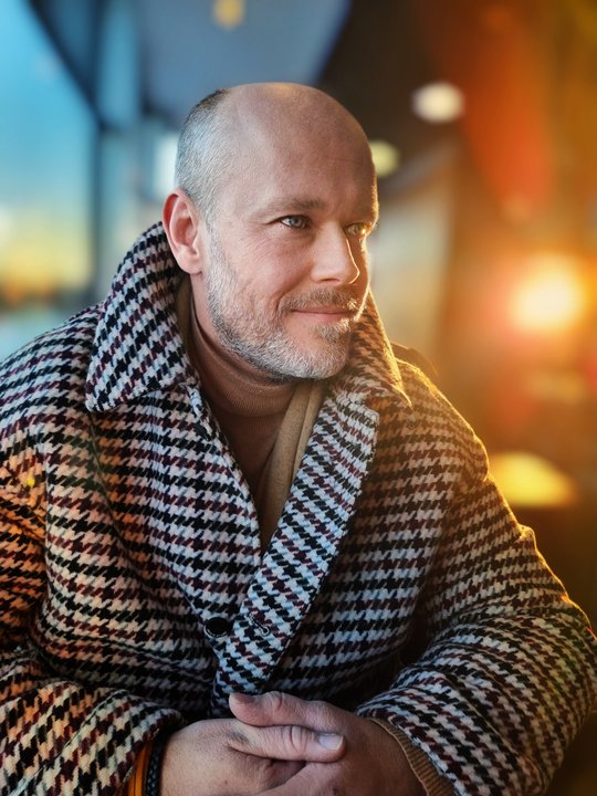 Petr Lukeš wearing a boldly patterned coat